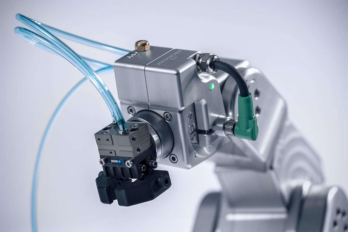 Pneumatic module connected to the Meca500 and to a double-action pneumatic gripper